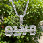 Load image into Gallery viewer, DUBSS - Iced Out Strike Through Pendant
